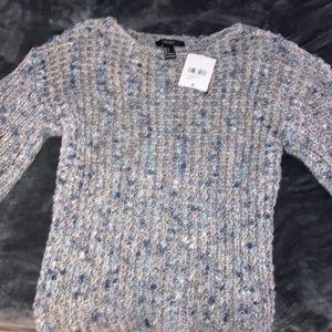 A grey/blue sweater
